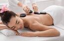 Picture of lady receiving Hot Stone Massage at Apple Spa 317-491-8917 best massage in Indianapolis